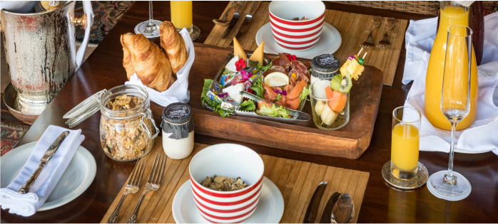 Indulge in a diverse breakfast spread showcasing culinary expertise at Camp Ndlovu.
