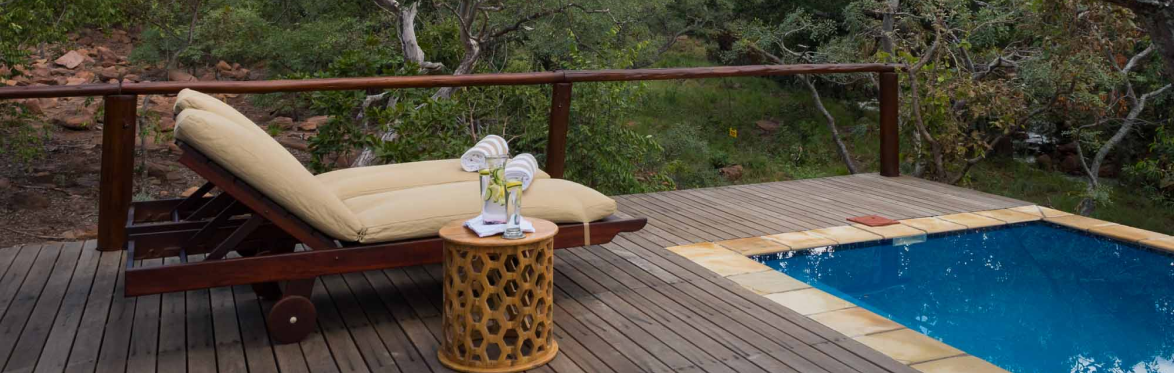 Outdoor pool area in nature, perfect spot for leisurely swimming under the African sun.