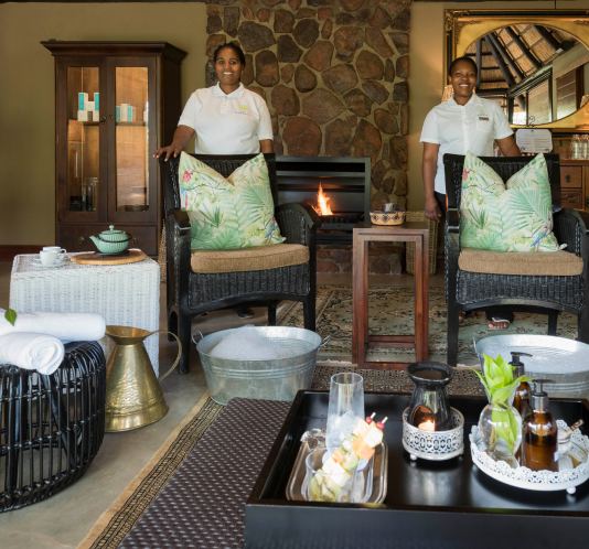 Two of Camp Ndlovu's dedicated staff, always ready to provide exceptional service.